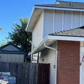 white gutters and full gutter system on 2 storied home