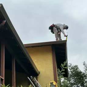 gutter installation on the edge of a roof