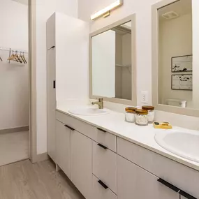 Double sink bath vanity and large walk in closet