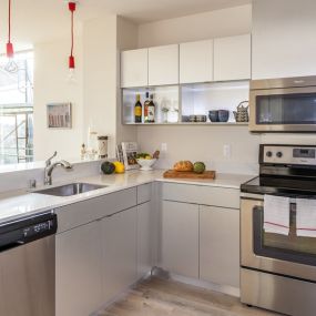Kitchen with modern appliances at Decibel on 12th