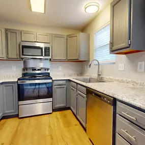 Kitchen with granite counter tops and stainless steel appliances