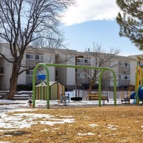 a playground with a dusting of snow