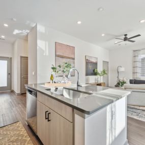 Kitchen with a large island and a living room