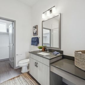 Bathroom with a sink and a toilet and a shower