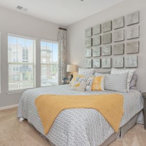 bedroom with three large windows