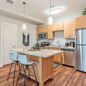 Sample Kitchen with Eat-In Island at Casa Azure 55+ Apartments