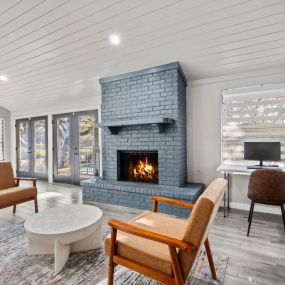 Living room with a fireplace and two chairs