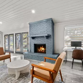 Living room with a fireplace and two chairs