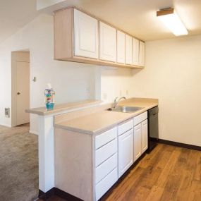 Kitchen and living room at Crown Court Apartments