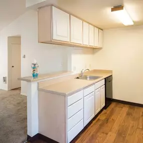 Kitchen and living room at Crown Court Apartments