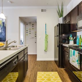 Shaker-style mocha cabinetry with brushed nickel hardware