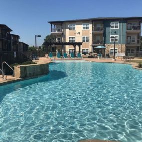 Invigorating swimming pool with sunning deck