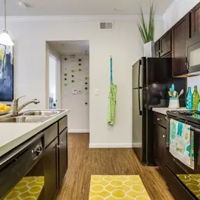 Shaker-style mocha cabinetry with brushed nickel hardware