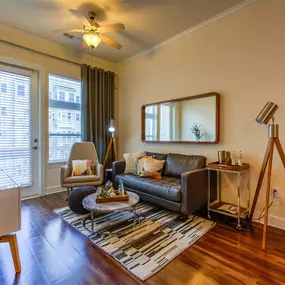 living room with sofa, rug, and coffee table