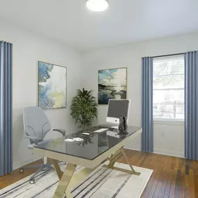 a home office with white walls and wood floors