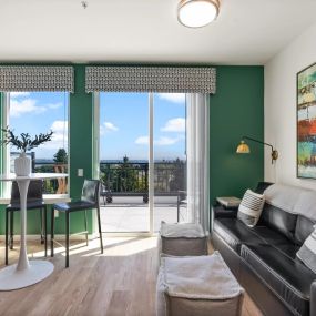 a living room with green walls