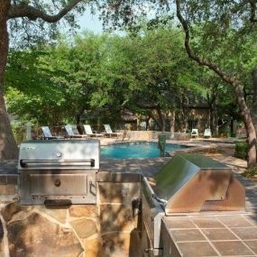 a resort-style pool with outdoor grilling