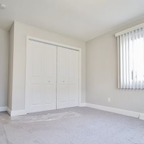 Bedroom with Large Windows and Coverings