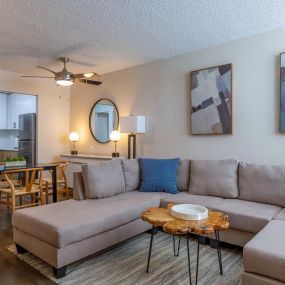 living room with sectional and dining table