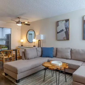 living room with sectional and dining table