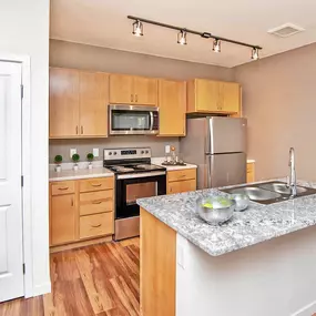 Kitchen with Eat-in Island at Scharbauer Flats