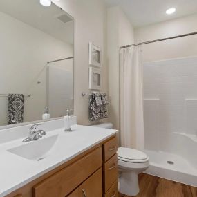 Bathroom with Walk-in Shower at Oaks Landing Apartments