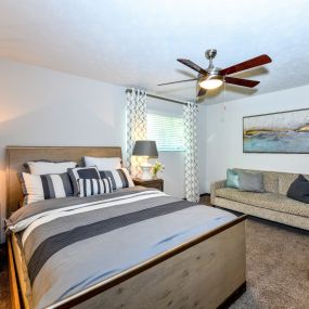 Bedroom with ceiling fan and light