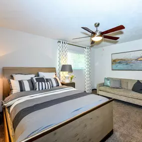 Bedroom with ceiling fan and light