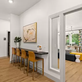 a dining room and living room with a table and chairs