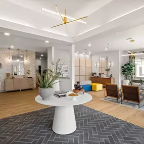 a living room with a white table and a rug