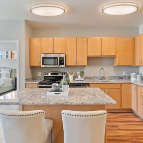 Kitchen with Eat-in Island at The Harbor at Twin Lakes Apartments