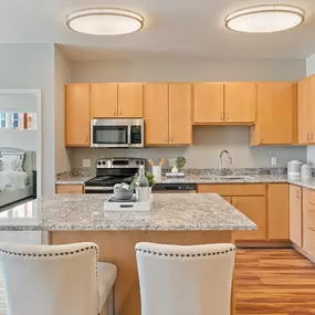 Kitchen with Eat-in Island at The Harbor at Twin Lakes Apartments