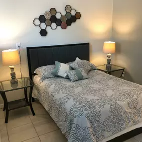 bedroom with bedside tables and lamps