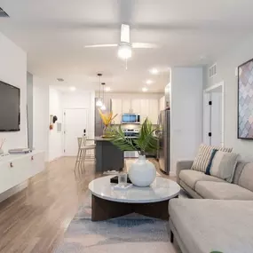 Spacious floor living room with wood inspired flooring throughout