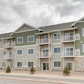 an apartment building on the side of a street, Pinehurst Apartments, Baxter