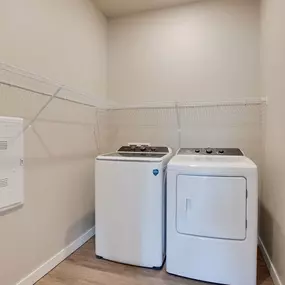 two washes and dryers in a laundry room with a rack on the wall, Pinehurst Apartments, Baxter, MN, 56425