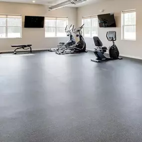 an empty gym with exercise equipment on the floor, Pinehurst Apartments, Baxter, 56425