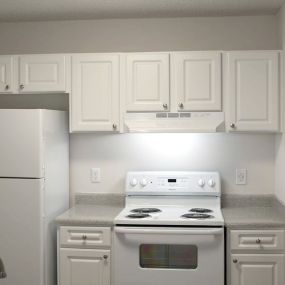 kitchen with white appliances and cabinets