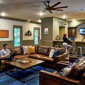 Resident lounge with kitchen and counter seating.