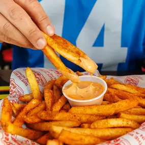 Basket of seasoned fries at Taystee's Burgers