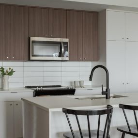 Spacious kitchen with island and modern finishes.