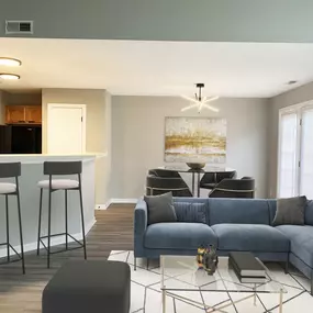 Experience the perfect balance of style and comfort in this spacious open-concept living and dining area at Mansfield Village Townhomes.