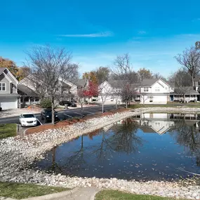 The scenic pond at Mansfield Village Townhomes creates a tranquil backdrop, perfect for unwinding after a long day.