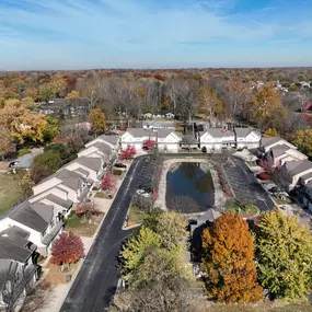 This aerial perspective highlights the beautifully designed Mansfield Village Townhomes, offering a perfect blend of nature and modern living.