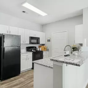 Spacious kitchen with breakfast bar.