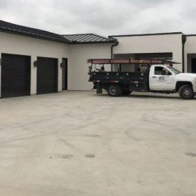 WE OFFER COMPREHENSIVE COMMERCIAL GARAGE DOOR SERVICES.