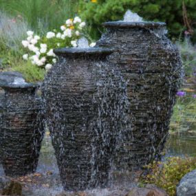 WHEN WE TACKLE PONDLESS WATER FEATURE INSTALLATIONS, WE CAN CUSTOMIZE THE DESIGN FOR EACH CLIENT.