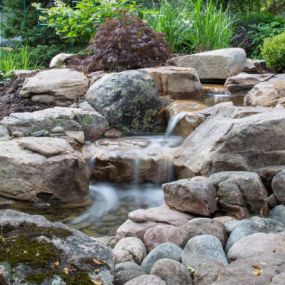 TRANSFORM YOUR MUNDANE PROPERTY INTO A PIECE OF PARADISE WITH A WATERFALL.