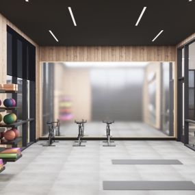 Yoga studio with mirrors, mats and exercise balls.