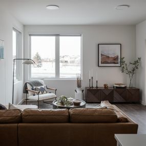 Open concept living room with luxury vinyl plank flooring and unobstructed mountain views.